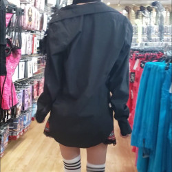 Pic #2 Exposed at adult store school girl skirt no panties